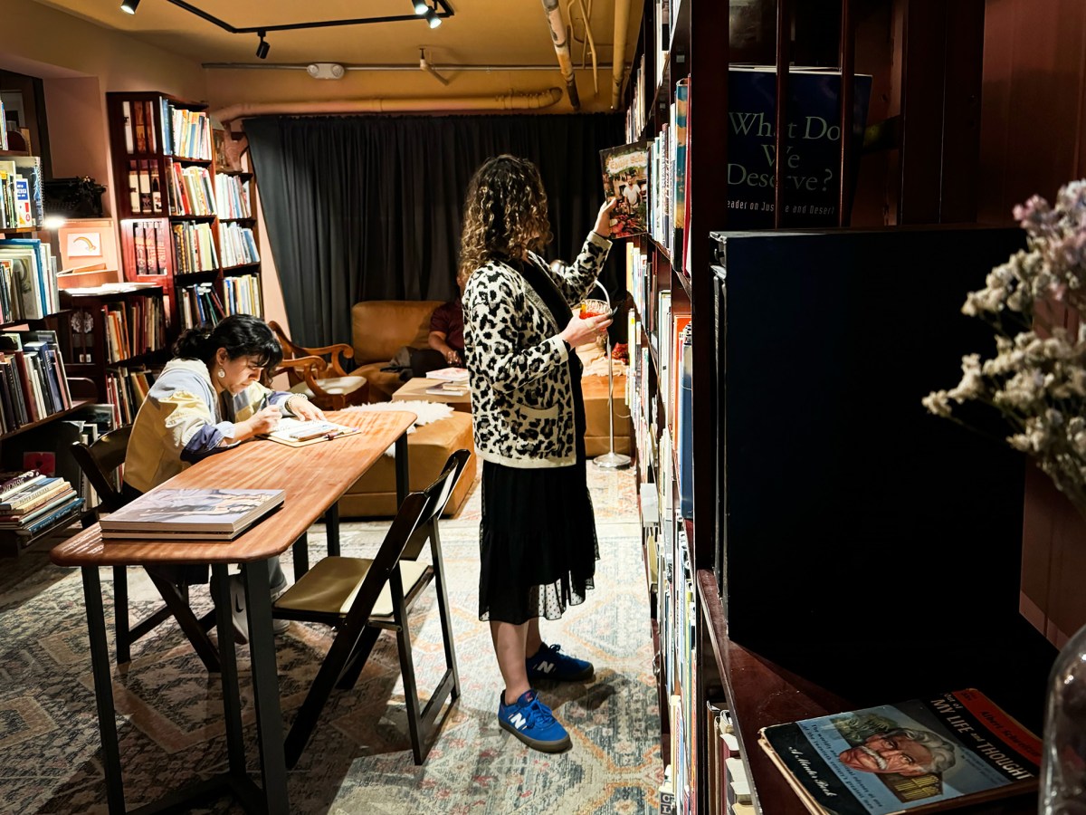 At this Oakland basement bookstore customers, browse with cocktails in hand